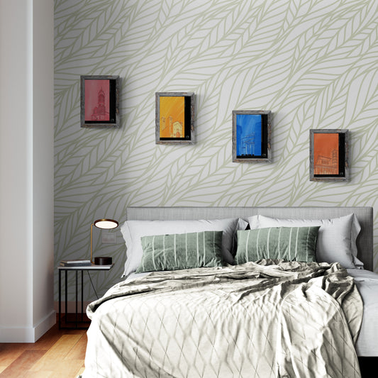 Quatre affiches picturales églises romaines disposées en escalier au-dessus d'un lit défait