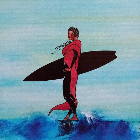 affiche d'une surfeuse debout devant l'océan