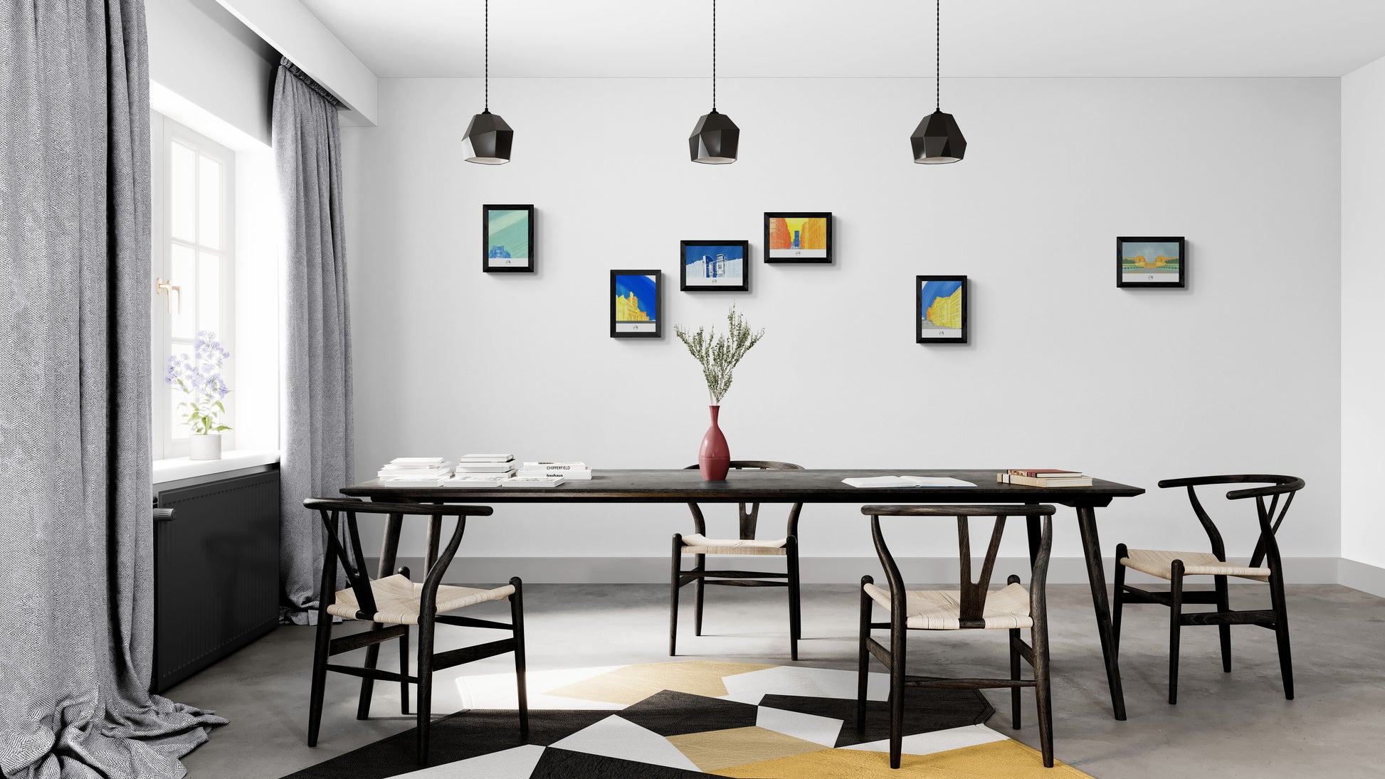 Cinq affiches picturales immeubles Paris au-dessus d'une grande table de salle à mange